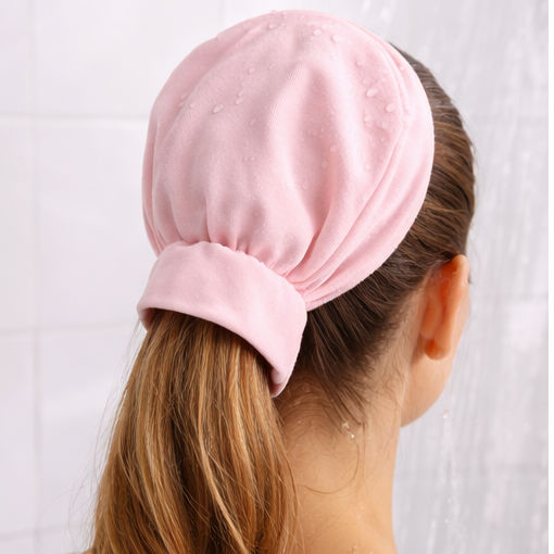 Person wearing a pink headscarf with a white background